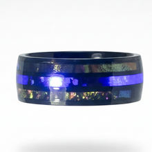 Load image into Gallery viewer, A wide black stainless steel ring band featuring a vibrant blue horizontal stripe and an iridescent inlay of shimmering colors along the bottom edge, shown on a white background.
