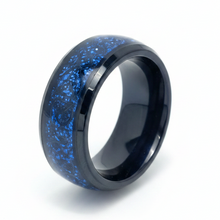 Load image into Gallery viewer, A polished black ring band featuring a vibrant blue glitter inlay, shown on a clean white background.