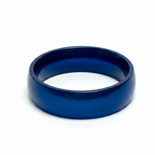Load image into Gallery viewer, A smooth, polished blue stainless steel ring band photographed on a clean white background.
