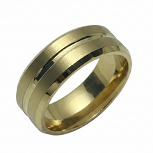 Load image into Gallery viewer, A gold stainless steel band ring with a brushed finish and polished beveled edges, shown on a plain white background.