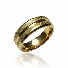 Load image into Gallery viewer, A gold band ring with a textured, glitter outer surface and polished beveled edges, shown on a plain white background.