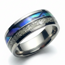 Load image into Gallery viewer, A polished stainless steel band ring featuring a central inlay of iridescent abalone shell with blue, purple, and green tones, bordered by textured silver inlays.
