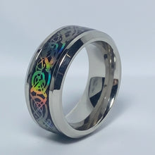 Load image into Gallery viewer, A stainless steel ring with a silver finish and black and iridescent patterns around the band.