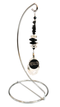 Load image into Gallery viewer, Metallica large suncatcher includes a stand. Decorated with crystals and snowflake obsidian gemstones.
