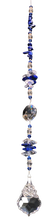 Load image into Gallery viewer, Lotus flower starburst suncatcher is decorated with crystals and lapis lazuli gemstones.
