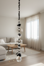 Load image into Gallery viewer, 30mm Crystal Ball Suncatcher decorated with paw print and snowflake obsidian gemstones CH473
