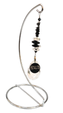 Load image into Gallery viewer, Metallica large suncatcher includes a stand. Decorated with crystals and snowflake obsidian gemstones.
