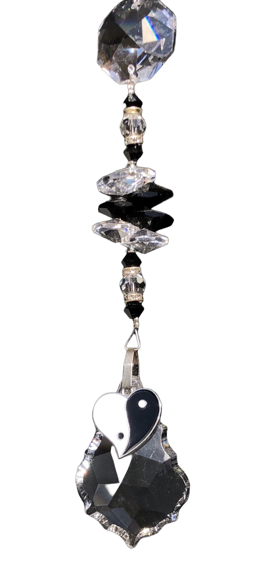 Ying & Yang heart, starburst suncatcher is decorated with crystals and snowflake obsidian gemstones.