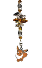 Load image into Gallery viewer, Eevee-  Pokémon suncatcher, decorated with carnelian gemstone
