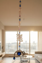 Load image into Gallery viewer, Eye Crystal Suncatcher decorated with Lapis Lazuli gemstones CH89
