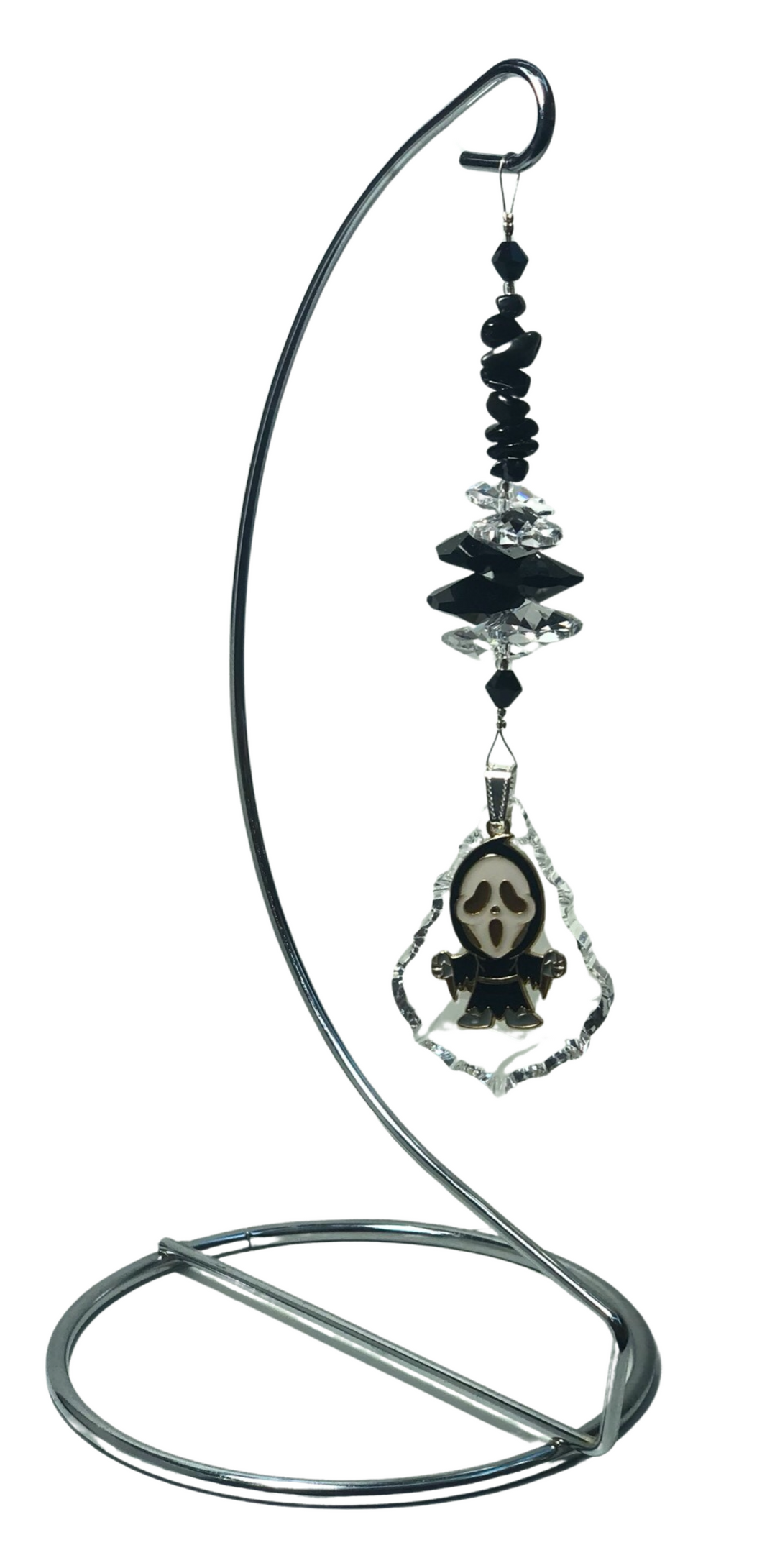 Ghost Face crystal suncatcher is decorated with snowflake obsidian gemstones and come on this amazing large stand