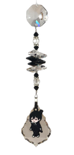 Load image into Gallery viewer, Chainsaw Man - Aki crystal suncatcher, decorated with 50mm Starburst crystal and snowflake obsidian gemstone.
