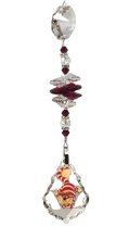 Load image into Gallery viewer, Alice in Wonderland - Cheshire Cat crystal suncatcher, decorated with 50mm Starburst crystal and garnet gemstone.
