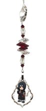 Load image into Gallery viewer, Naruto Sasuke Uchiha - crystal suncatcher, decorated with 50mm starburst crystal garnet gemstone.

