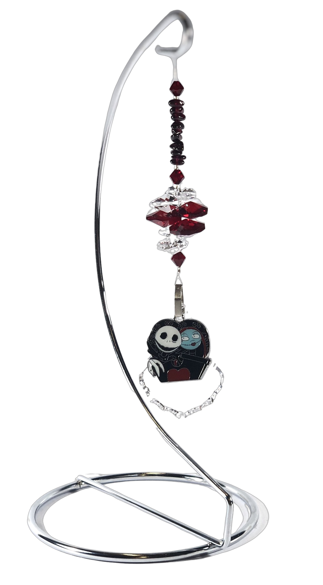 A Nightmare Before Christmas - Jack and Sally crystal suncatcher is decorated with garnet gemstones and come on this amazing stand.