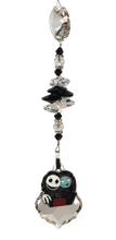 Load image into Gallery viewer, A Nightmare Before Christmas - Jack &amp; Sally crystal suncatcher, decorated with 50mm Starburst crystal and snowflake obsidian gemstone.
