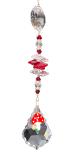 Load image into Gallery viewer, Mushroom 50mm Crystal starburst suncatcher, is decorated with crystals and garnet.
