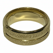 Load image into Gallery viewer, A gold-colored ring band featuring a polished edges and glitter bands. shown on a plain white background.
