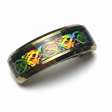 Load image into Gallery viewer, A gold-colored stainless steel ring with a multicolored iridescent pattern on the band.
