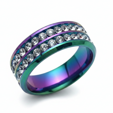 Load image into Gallery viewer, An iridescent rainbow-colored ring band with two rows of clear round rhinestones, shown on a white background.
