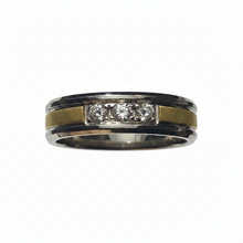 Load image into Gallery viewer, A two-tone ring band featuring a polished silver outer edge, a matte gold center stripe, and a three CZ. channel set in the middle.
