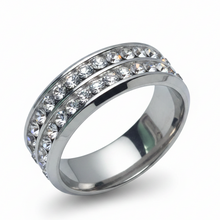 Load image into Gallery viewer, A silver sparkle ring with multiple clear stones set in a stainless steel band.
