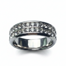 Load image into Gallery viewer, A silver sparkle ring with multiple clear stones set in a stainless steel band.
