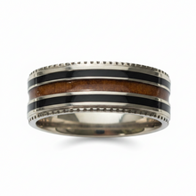 Load image into Gallery viewer, A polished silver-toned band ring featuring a central inlay of black enamel and warm brown wood, shown on a clean white background.
