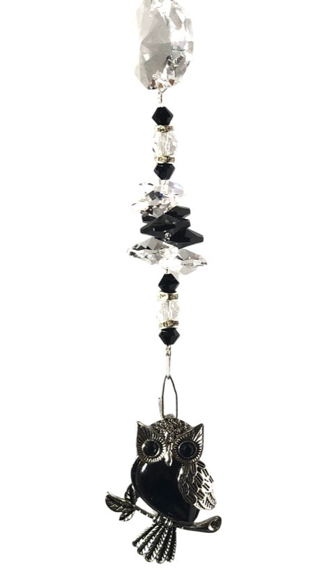 Owl suncatcher is decorated with crystals and Snowflake Obsidian gemstones