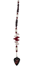 Load image into Gallery viewer, The Rolling Stones suncatcher, decorated with garnet gemstone.
