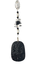 Load image into Gallery viewer, Carved Dragon suncatcher is decorated with crystals and Snowflake Obsidian gemstones
