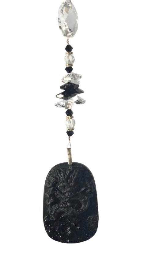 Carved Dragon suncatcher is decorated with crystals and Snowflake Obsidian gemstones