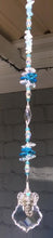 Load and play video in Gallery viewer, Elephant starburst crystal suncatcher is decorated with aquamarine gemstones.
