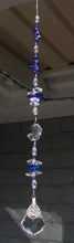 Load and play video in Gallery viewer, Lotus flower starburst suncatcher is decorated with crystals and lapis lazuli gemstones.
