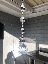 Load and play video in Gallery viewer, This large 50mm crystal ball suncatcher is decorated with crystal and snowflake obsidian
