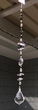 Load and play video in Gallery viewer, Starburst suncatcher is decorated with crystals and snowflake obsidian gemstones.
