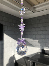 Load and play video in Gallery viewer, This large 40mm crystal ball suncatcher is decorated with crystal and amethyst
