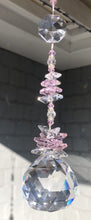 Load and play video in Gallery viewer, This large 50mm crystal ball suncatcher is decorated with crystal and rose quartz.
