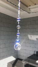 Load and play video in Gallery viewer, This large 50mm crystal ball suncatcher is decorated with crystal and blue lace agate
