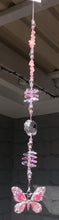 Load and play video in Gallery viewer, Pink butterfly suncatcher is decorated with crystals and rose quartz gemstones.
