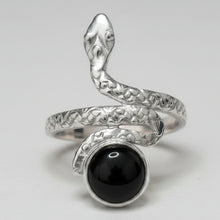 Load image into Gallery viewer, Sterling Silver snake-shaped ring with a black onyx gemstone on a gray background
