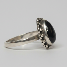 Load image into Gallery viewer, Sterling Silver ring with a black onyx gemstone on a gray background

