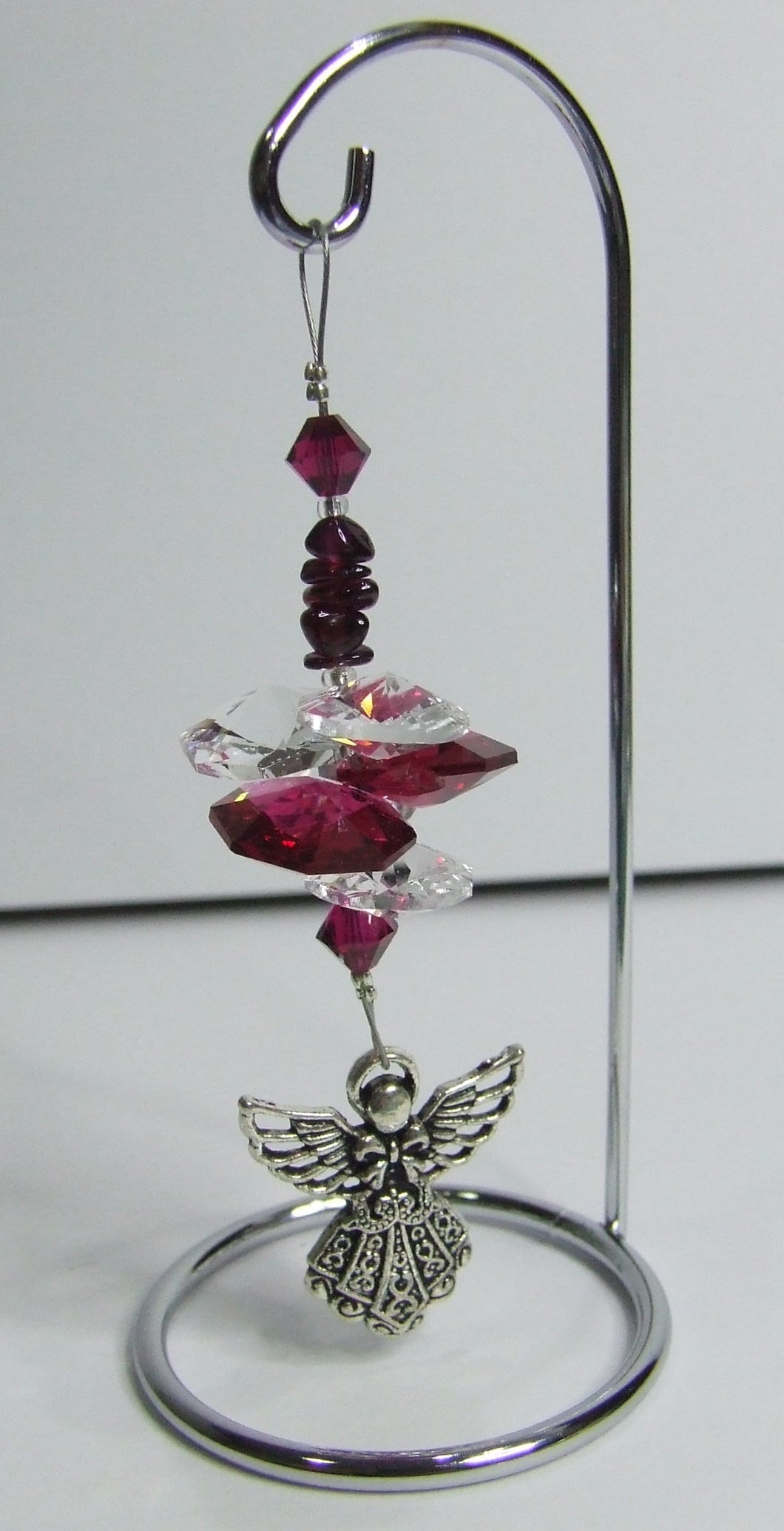 Angel - red crystal suncatcher is decorated with garnet and comes on this amazing small stand.