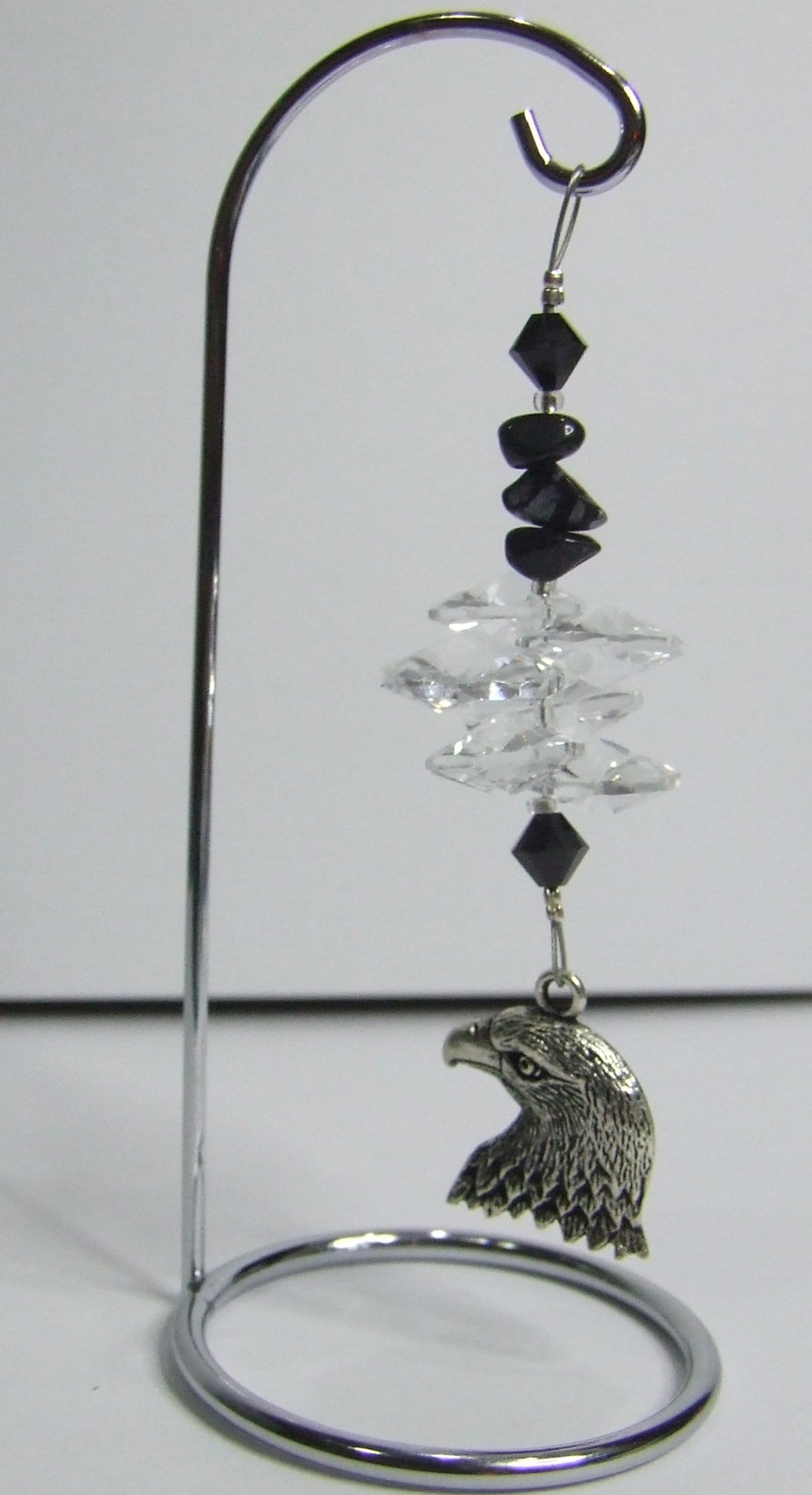 Eagle - black crystal suncatcher is decorated with snowflake obsidian gemstones and come on this amazing small stand.