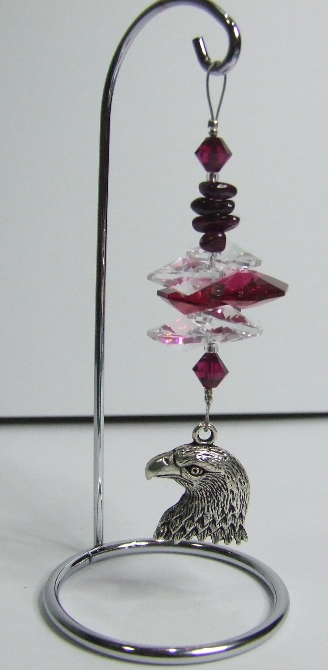 Eagle - red crystal suncatcher is decorated with garnet gemstones and come on this amazing small stand.