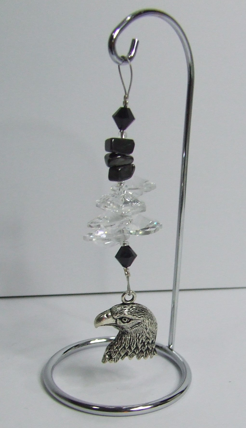 Eagle - black crystal suncatcher is decorated with hematite gemstones and come on this amazing small stand.