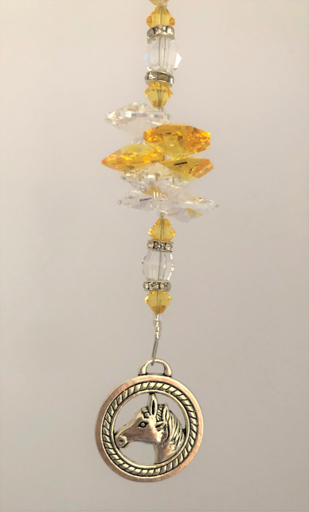 This beautiful Horse suncatcher which is decorated with crystals and Citrine