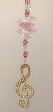 Load image into Gallery viewer, This beautiful Music Note Clef suncatcher which is decorated with crystals and Rose Quartz
