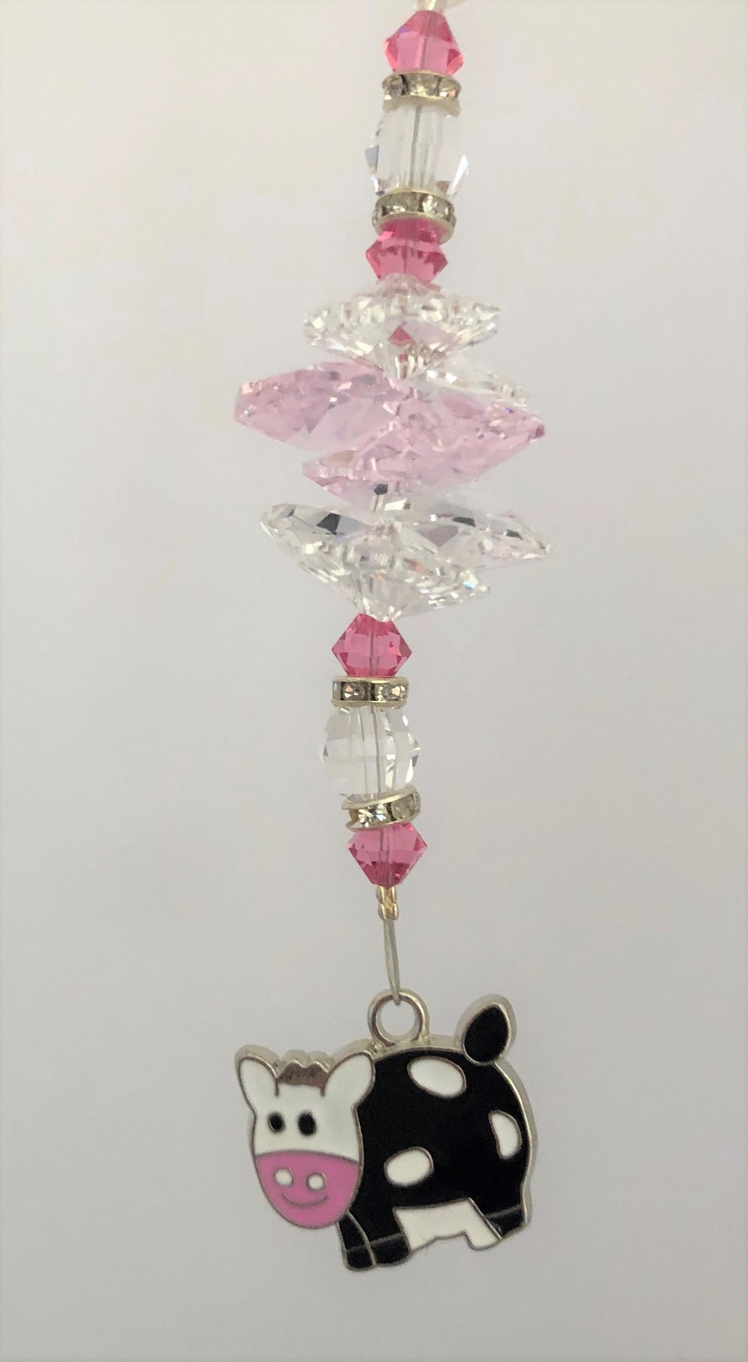 This beautiful Cow  suncatcher which is decorated with crystals and Rose Quartz