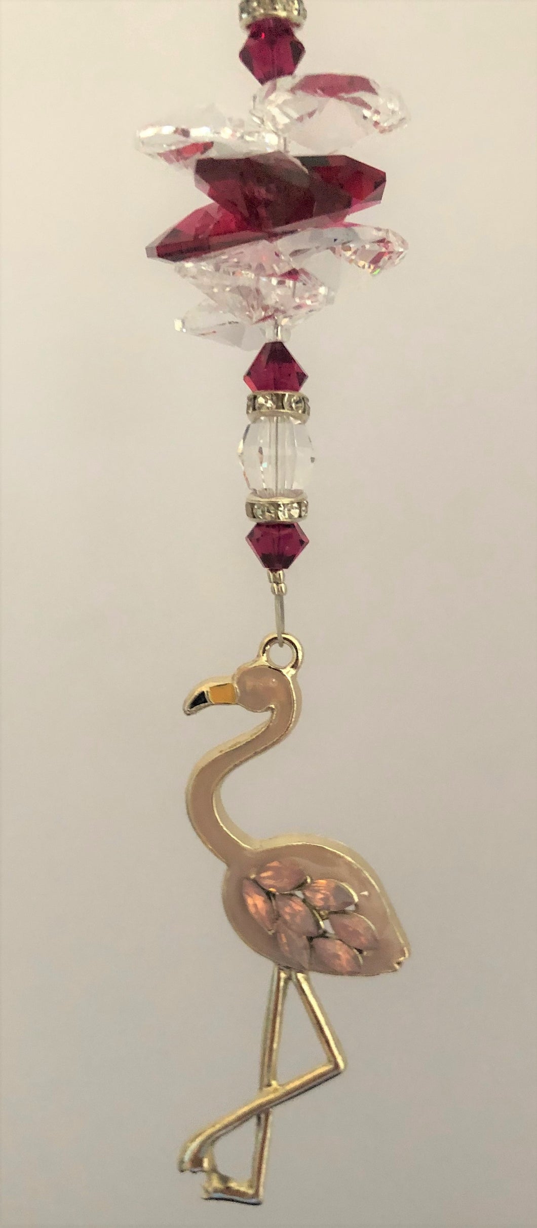 This beautiful Pale pink Flamingo suncatcher which is decorated with crystals and Garnet
